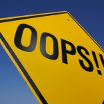 Road sign reading "oops"
