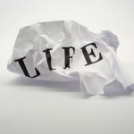 Life: crumpled paper with the word, 'life' printed on it.