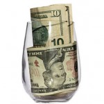 Glass with money bills in it.