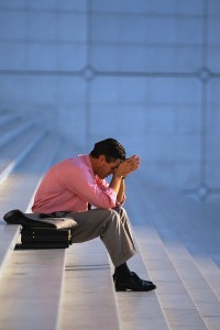 Businessman Thinking on Steps