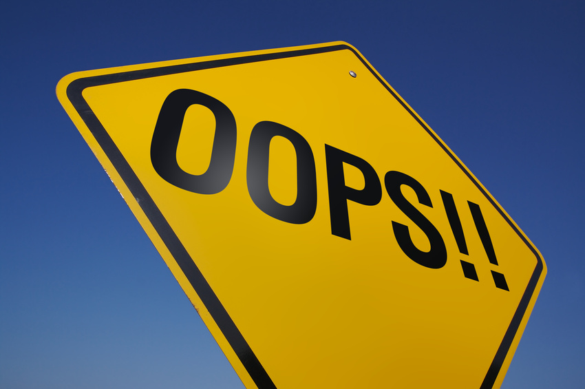 Road sign reading "oops"