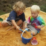 kids playing in sandbox