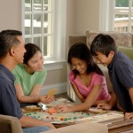 Family playing a board game