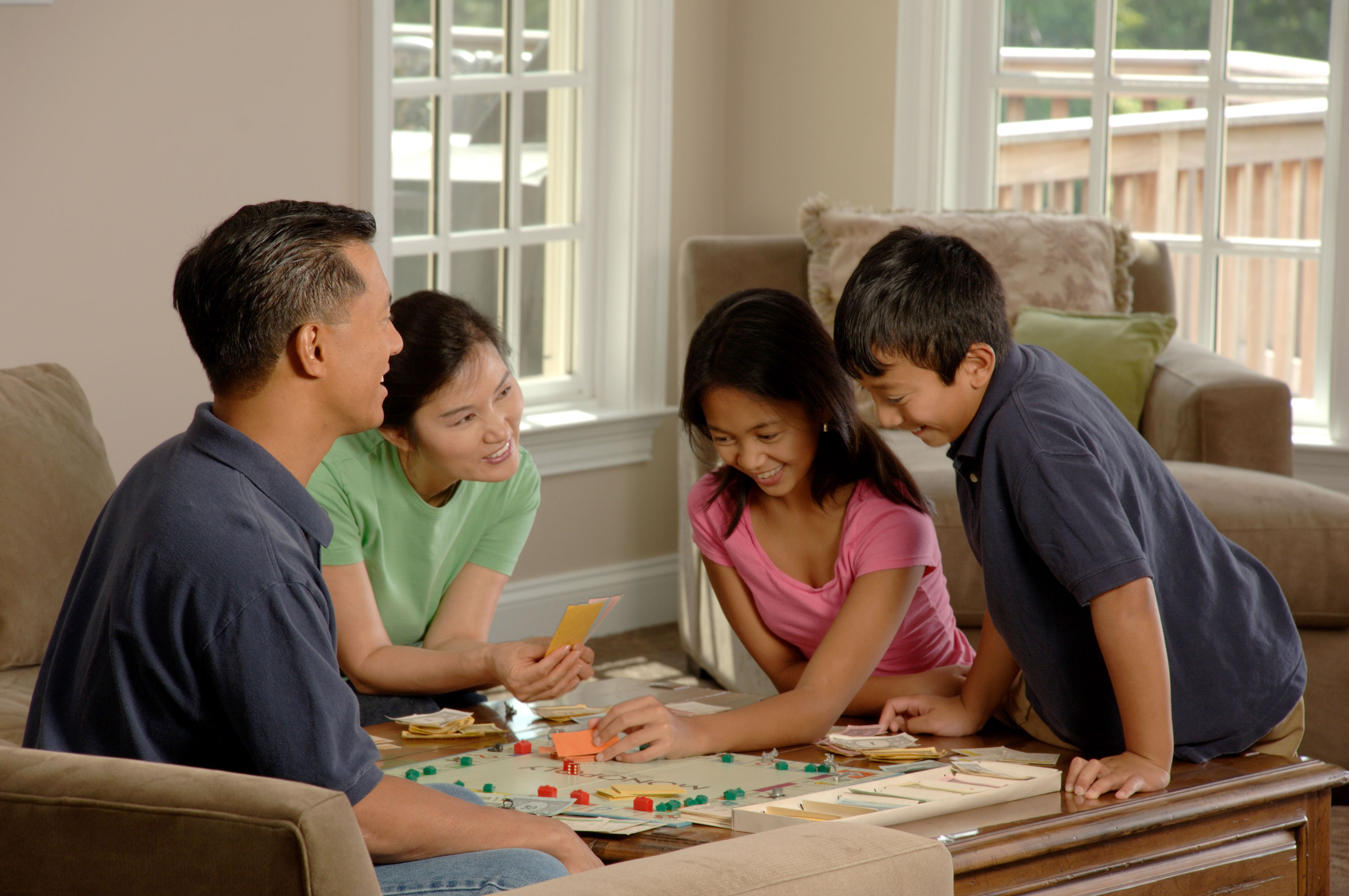 Family playing a board game