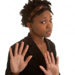 woman with her hands up protectively