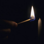 The Fourth Law of Influence match lights a candle