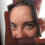 woman looking in mirror