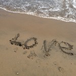 The word "love" written in the sand