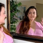 Woman looking in a mirror
