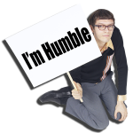  Man  holding a sign  that says , "I'm humble"