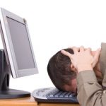 Man banging head on keyboard