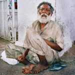 man begging and receiving charity
