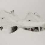 house buried in snow