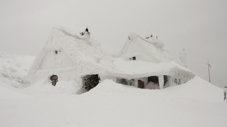 house buried in snow