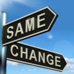 two directional signs: one says "same" and the other says "change"