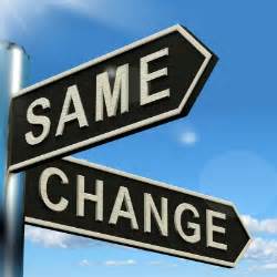 two directional signs: one says "same" and the other says "change"
